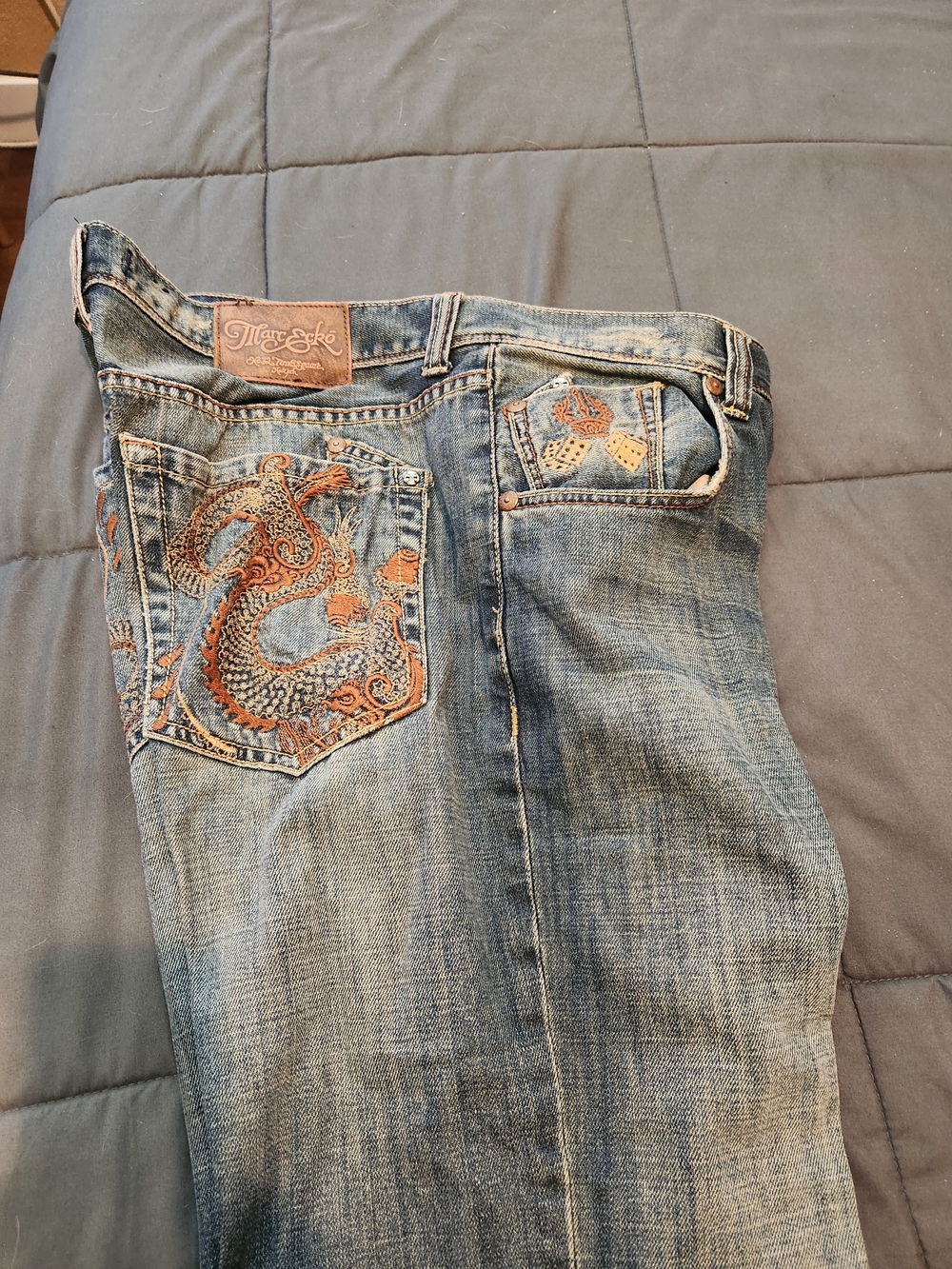Marc Ecko Blue Denim Boot-Cut Jeans with Orange Embroidery